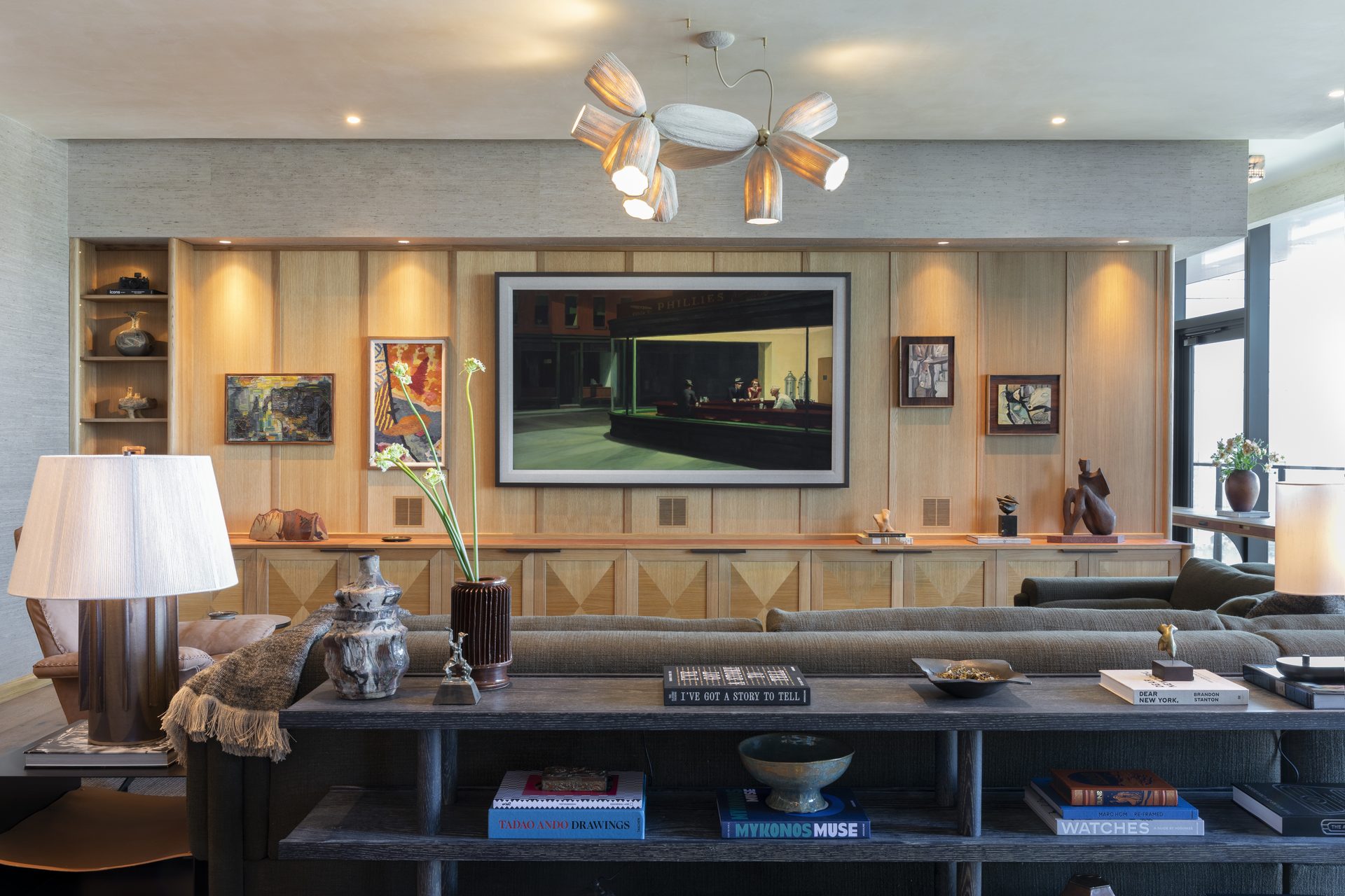 Hotel or condo common area with layered lighting and concealed speakers.
