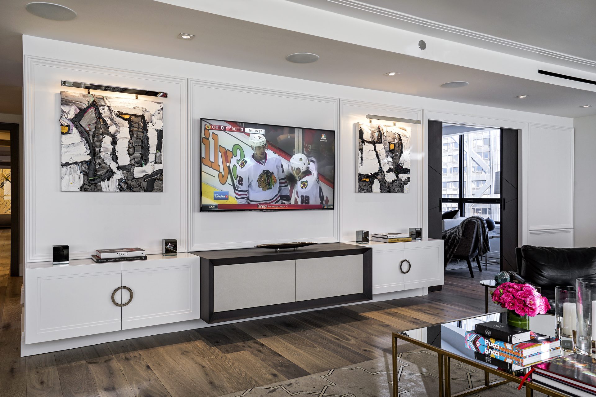 Boardroom with a large display and a single table-top control interface.